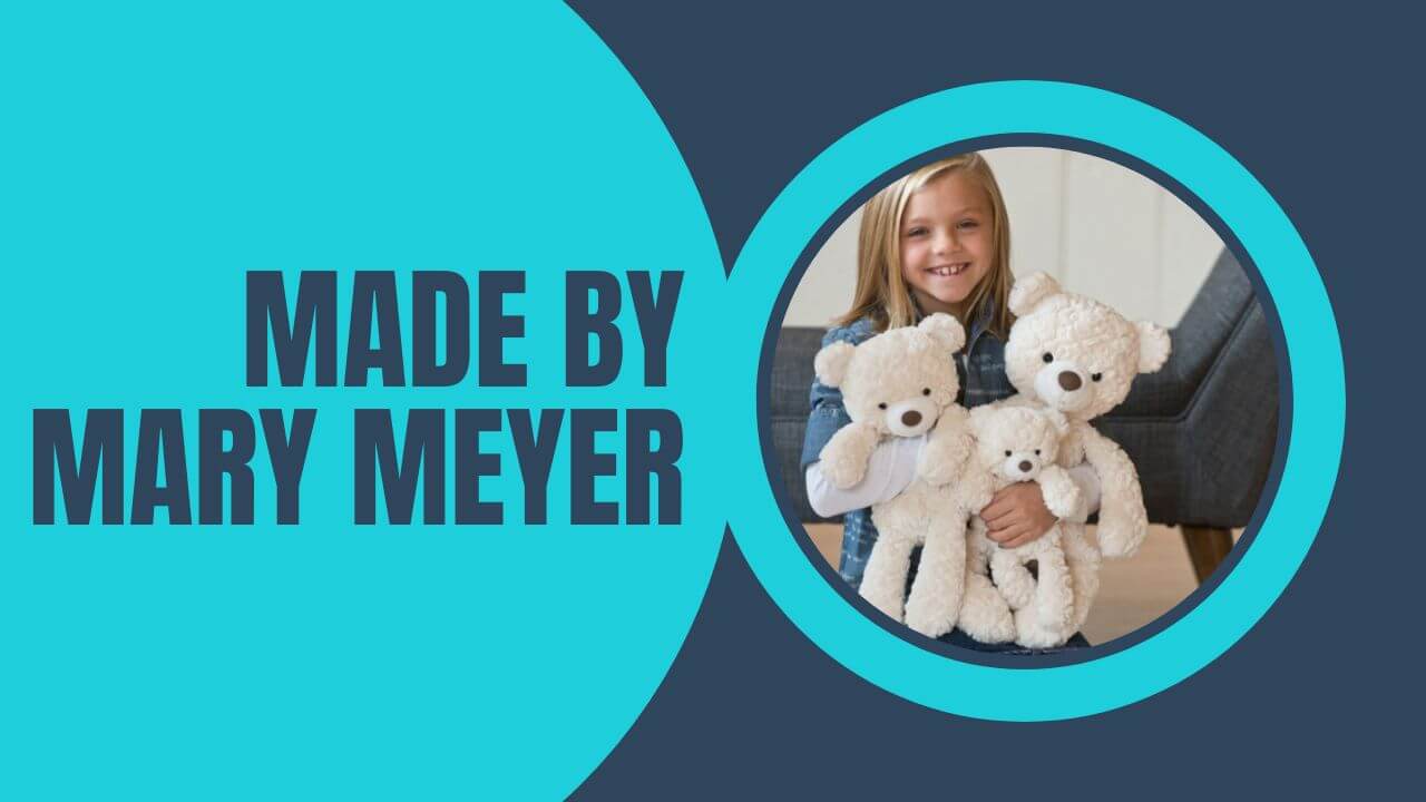 Soft toys and baby toys made by the Mary Meyer Corporation. Girl holding three teddy bears.