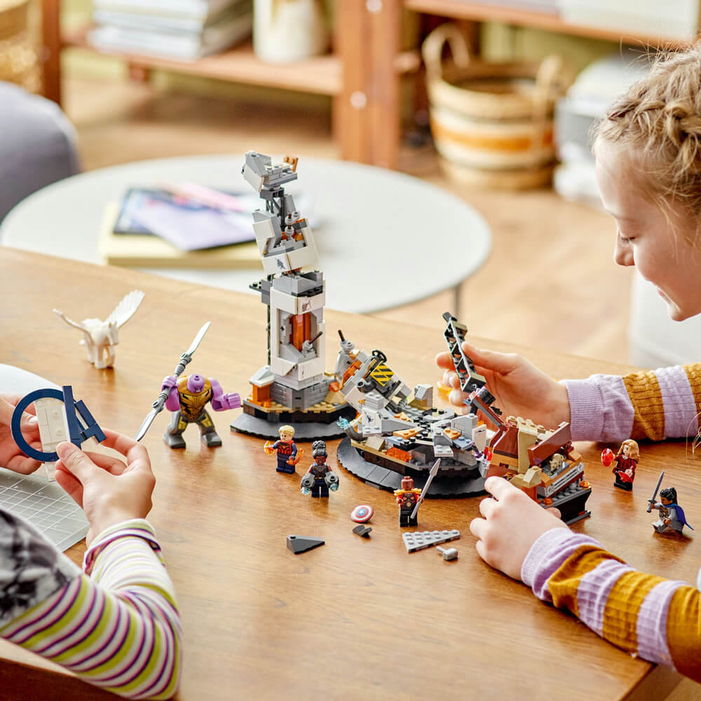 Two kids building the LEGO® Marvel Endgame Final Battle 76266 Building Toy Set (794 Pieces)