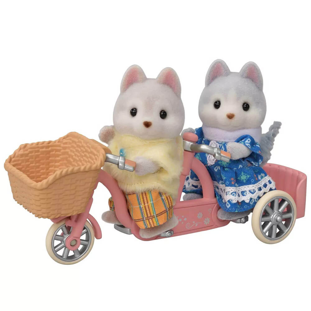 Husky brother and sister riding the bike of the Calico Critters Tandem Cycling Set with Husky Sister & Brother
