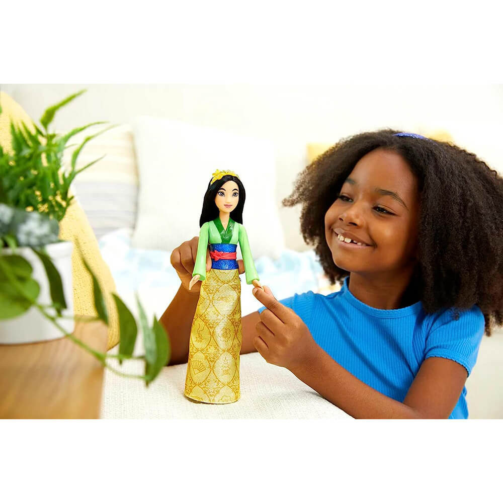 Little girl playing with Disney Princess Mulan Fashion Doll