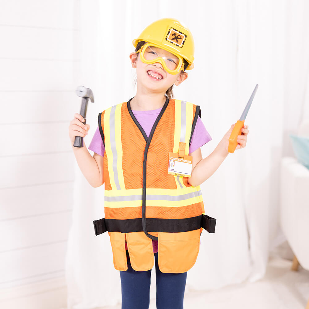Girl dressed up in the Melissa and Doug Construction Worker Role Play Costume Set