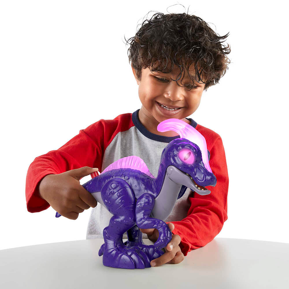 Child playing with the Imaginext Jurassic World Deluxe Parasaurolophus XL Dinosaur