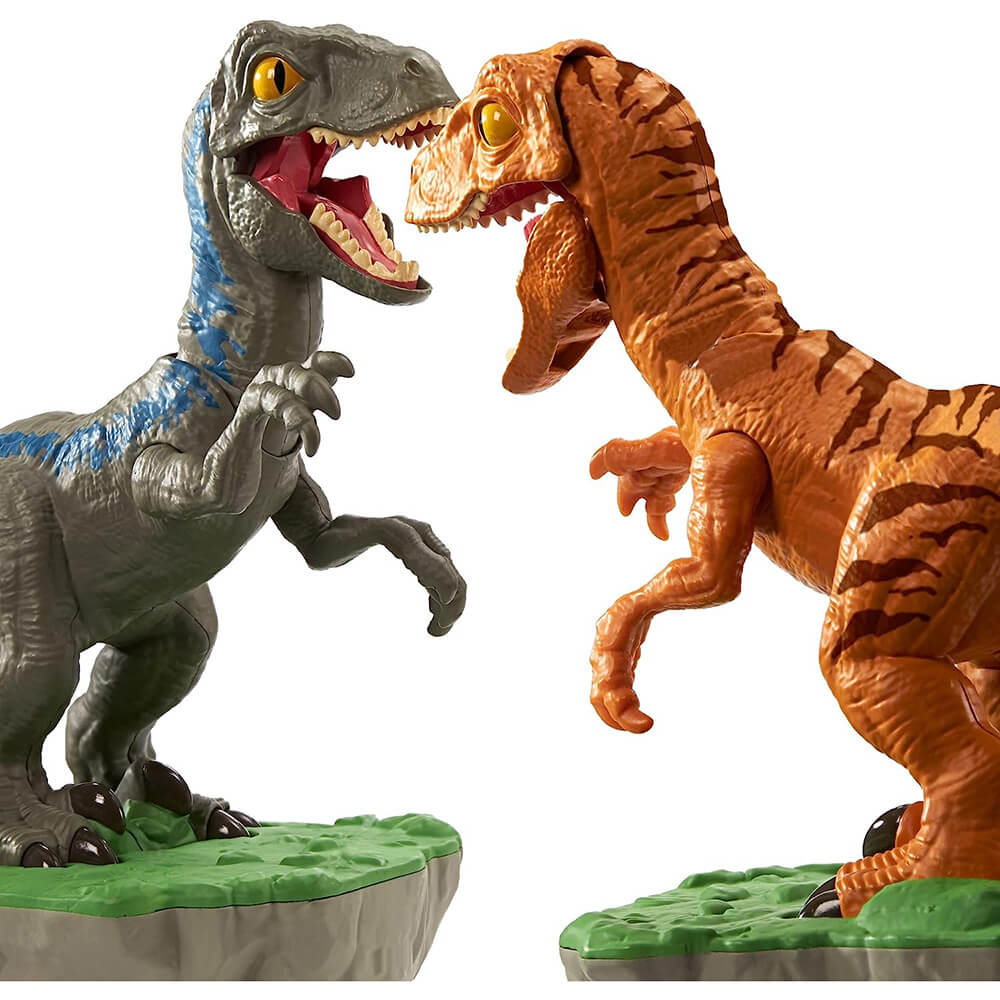 Dinos from the Jurassic World Rock 'em Sock 'em Robots Blue vs Atrociraptor Game fighting