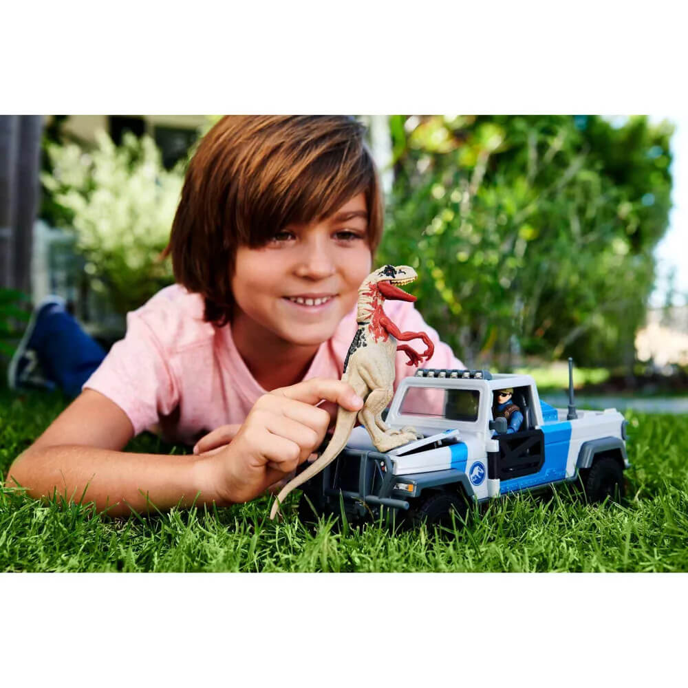 Child playing with Jurassic World Search 'n Smash Truck Playset