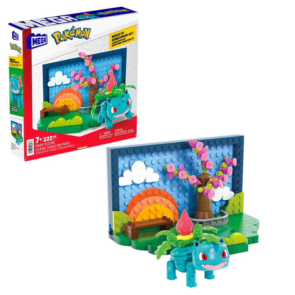 Mega Pokémon Park Scene includes Ivysaur with vivid green grass, curved bench, tree with pink blossoms, and colorful orange sunset bricks against a blue backdrop with clouds.
