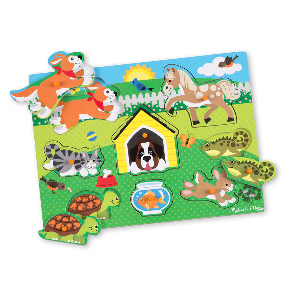 Pieces of the Melissa and Doug Pets 8 Piece Peg Puzzle removed to show