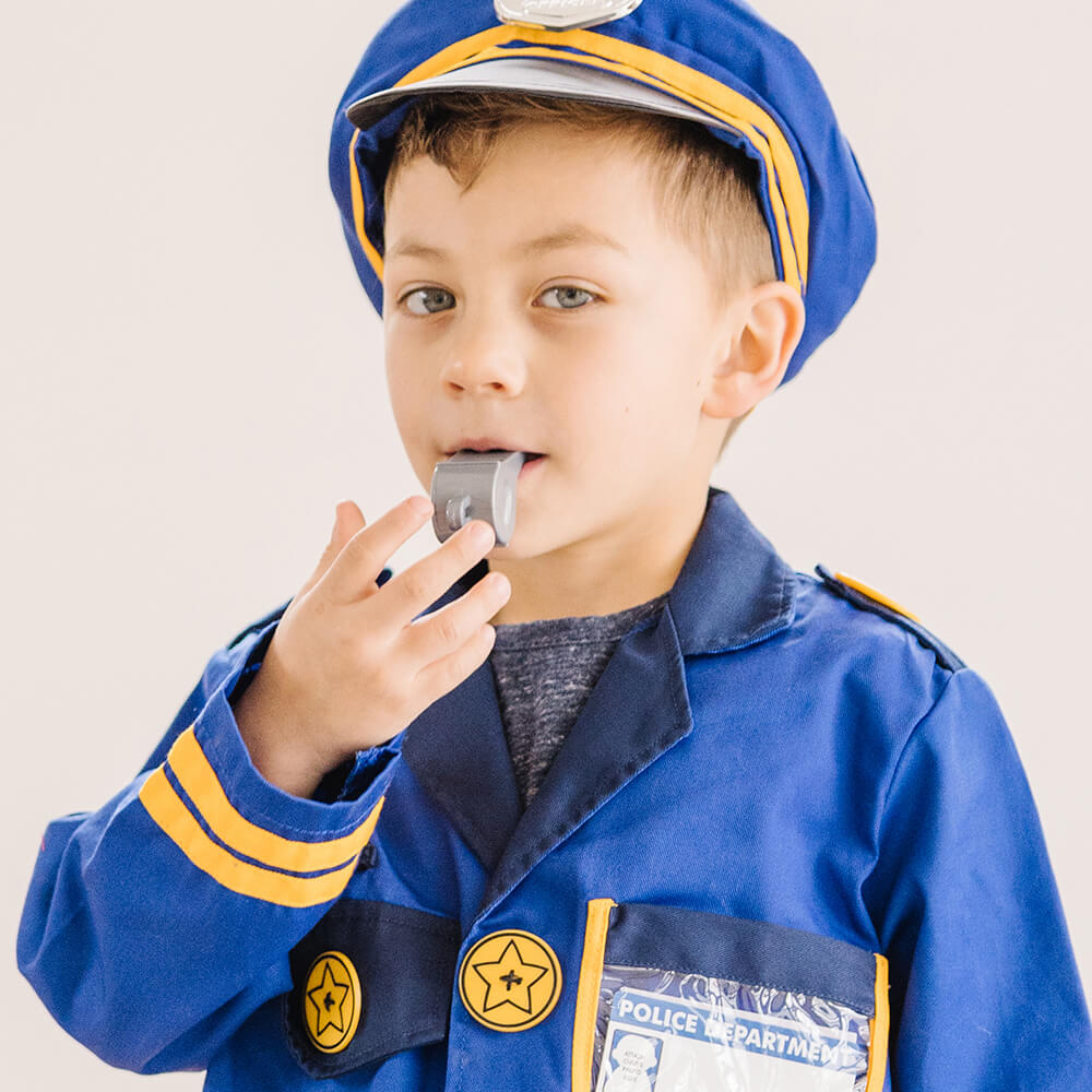 Boy blowing the police whistle from the Melissa and Doug Police Officer Costume Role Play Set