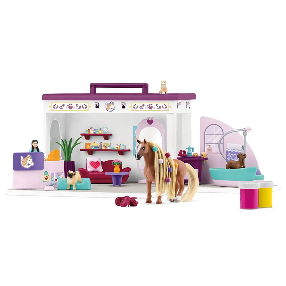 Back of the Schleich Horse Club Sofia's Beauties Pet Salon Set all set up to groom animals with a horse and dog and the woman standing behind the counter