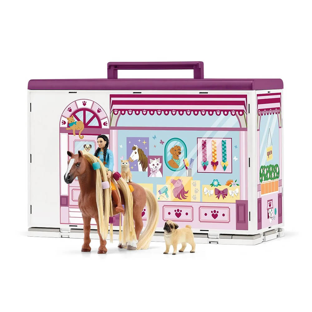 Front of the Schleich Horse Club Sofia's Beauties Pet Salon Set with horse and a girl sitting on top of the horseand a dog on the ground