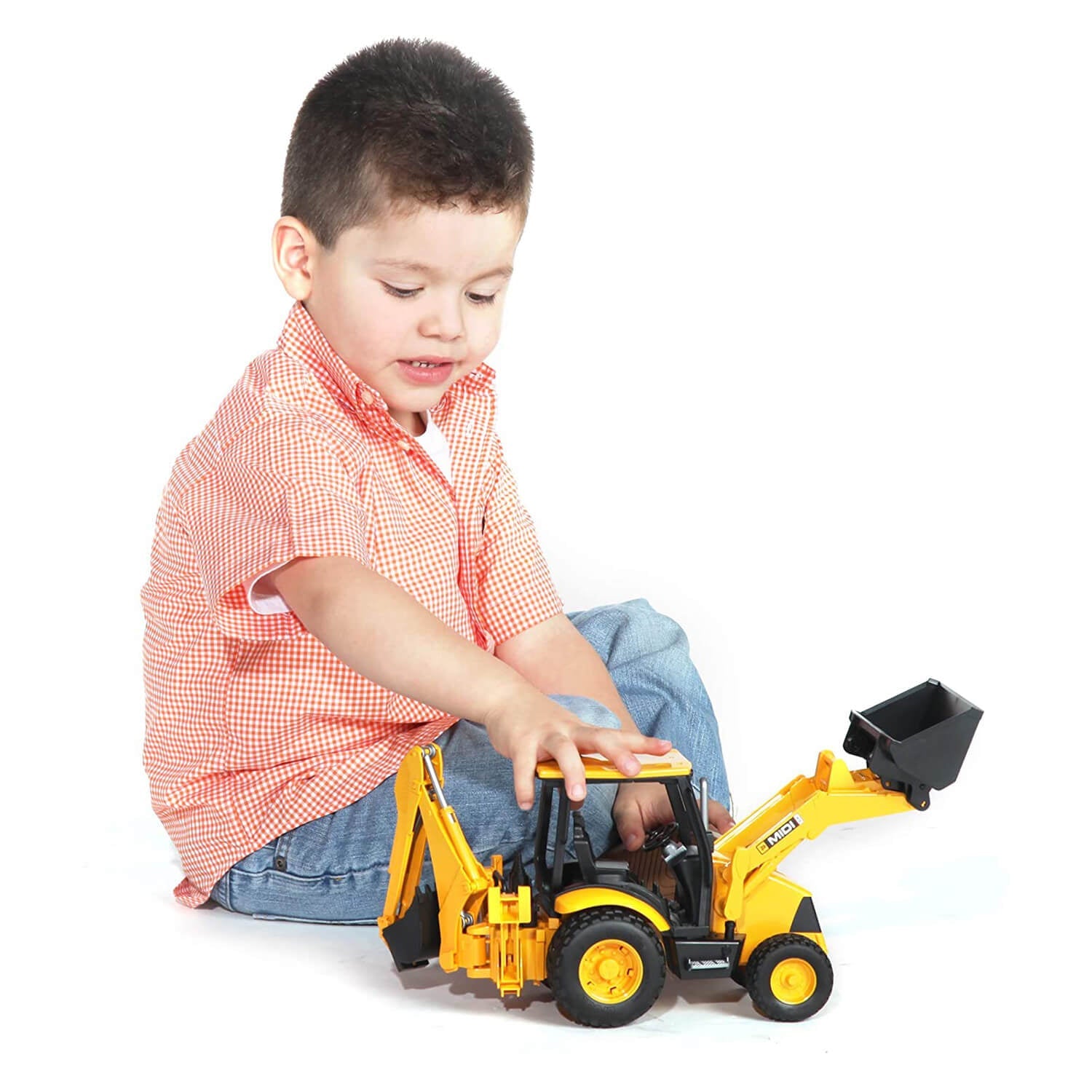 Kid playing with the JCB midi CX vehicle.