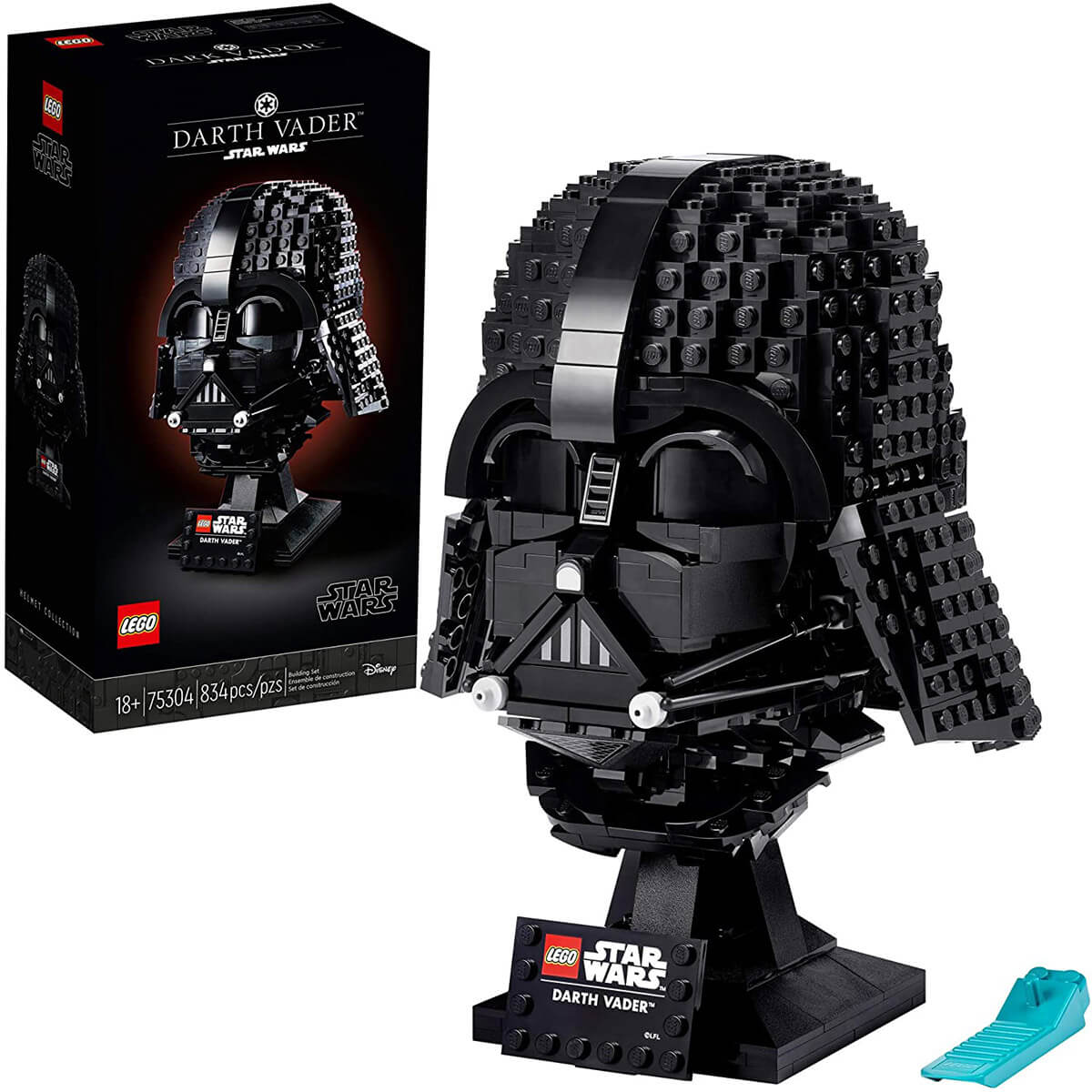 LEGO Darth Vader Helmet completed and displayed on a stand with package in the background.