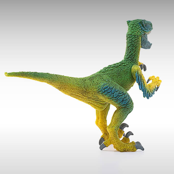 Rear view of the Schleich Dinosaurs Velociraptor figurine.