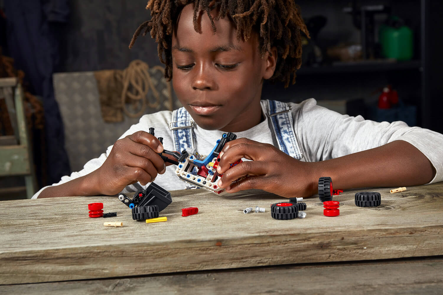 Boy builds the smallest LEGO Technic set.
