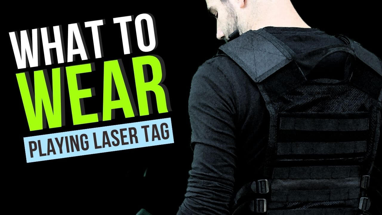 Man dressed in dark clothes shows what to wear for laser tag.
