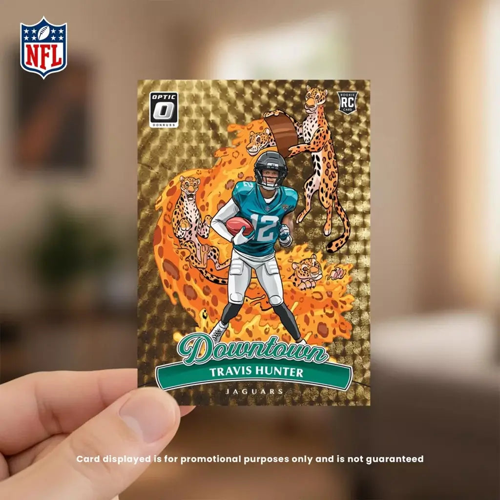Panini Donruss Optic Downtown football card in gold holographic foil with rectangular shape, featuring illustrated player and jaguar graphics, collectible insert card held in hand on blurred indoor background