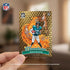 Panini Donruss Optic Downtown football card in gold holographic foil with rectangular shape, featuring illustrated player and jaguar graphics, collectible insert card held in hand on blurred indoor background