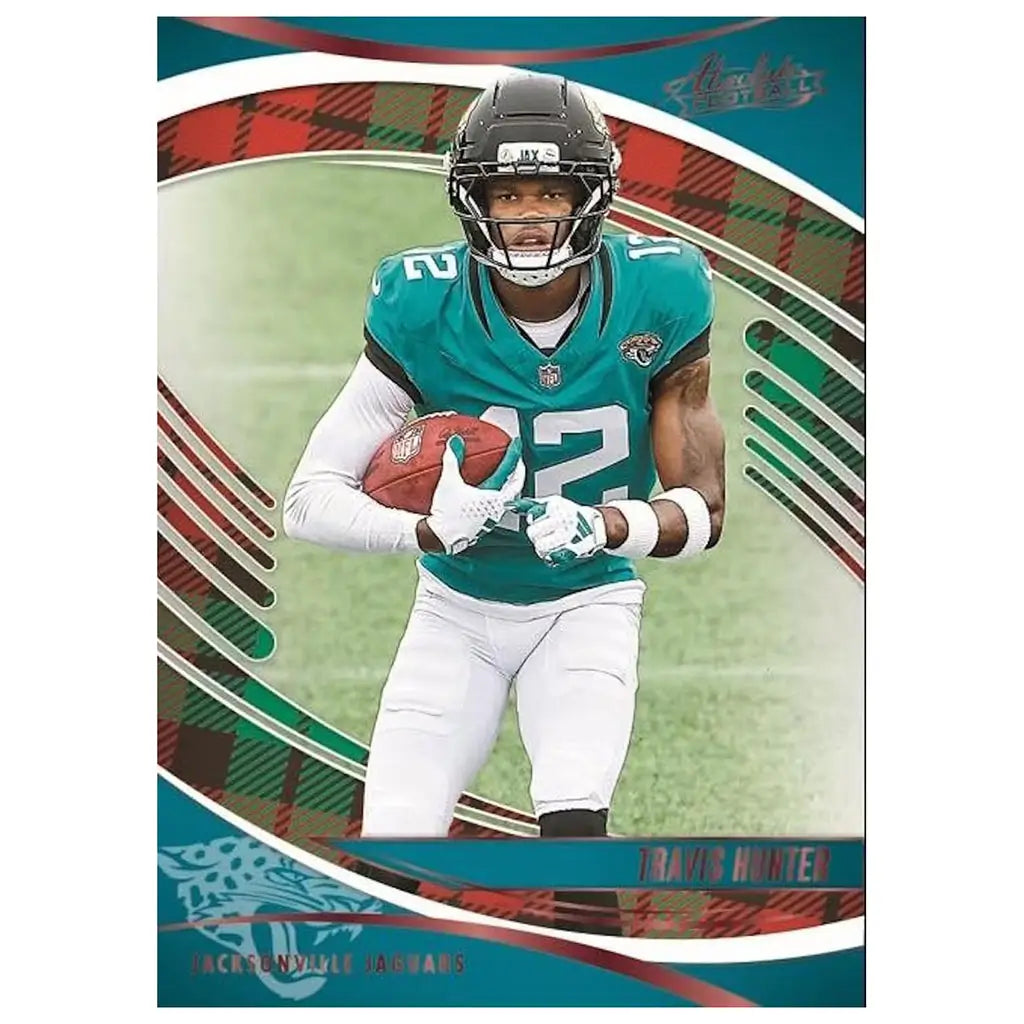 Panini Absolute Football card features rich teal tones and smooth printed texture around a sharply framed receiver mid-run, emphasizing player focus and field action within layered curved graphics.