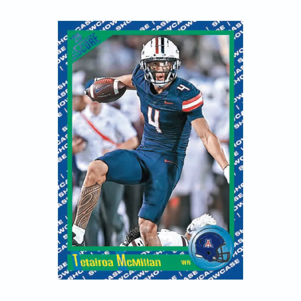 Blue-bordered 2025 Panini Score Showcase Rookie trading card of Tetairoa McMillan, wearing navy uniform with white helmet, leaping forward with the ball in an action shot.