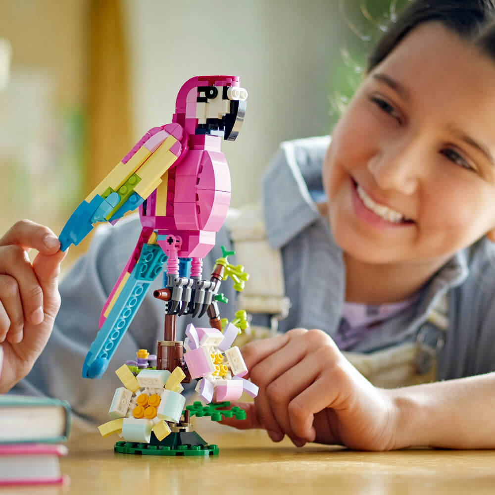Person show smiling at the completed LEGO® Creator Exotic Pink Parrot 31144 Building Toy Set (253 Pieces)