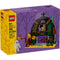 LEGO Halloween Barn set 40721 box features a spooky barn with boarded-up windows, twisted trees, and a skeleton figure, set against a purple background with shadowy trees and a full moon.