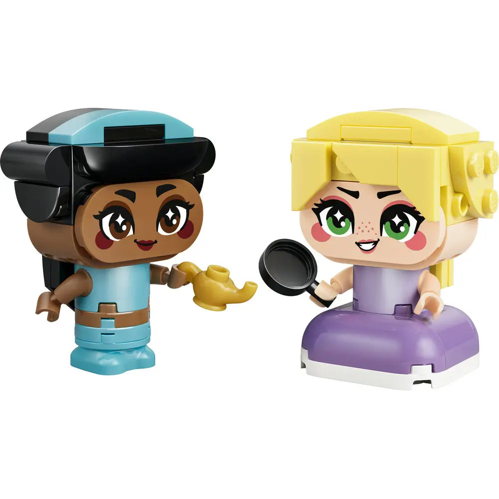 LEGO Disney Princess mini figure set showing teal and purple plastic characters with oversized heads, printed facial details, and handheld accessories, posed side by side on a clean white studio background.