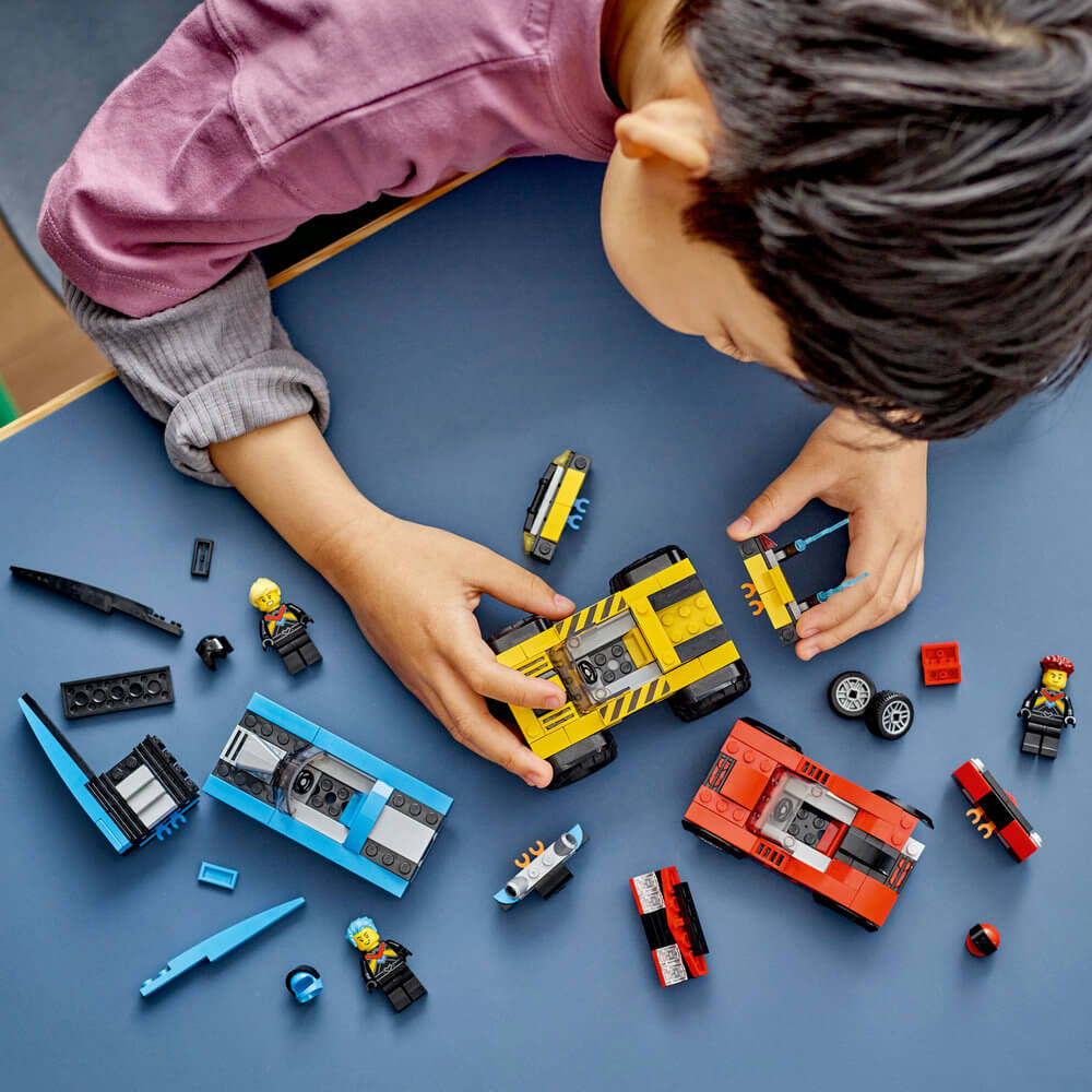 Child shown building the LEGO® City Combo Race Pack 60395 Building Toy Set (362 Pieces)