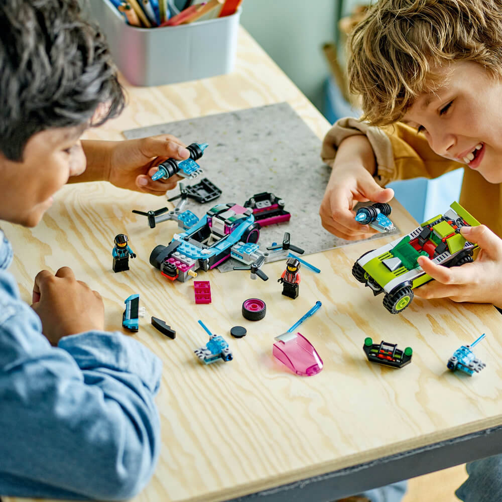 Two kids playing with the LEGO® City Modified Race Cars 60396 Building Toy Set (359 Pieces)