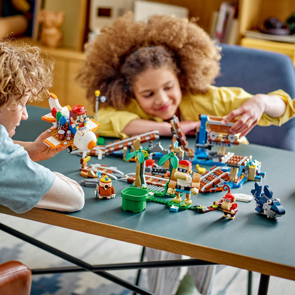Kids playing with the LEGO® Super Mario™ Diddy Kong's Mine Cart Ride Expansion Set 71425 (1,157 Pieces)