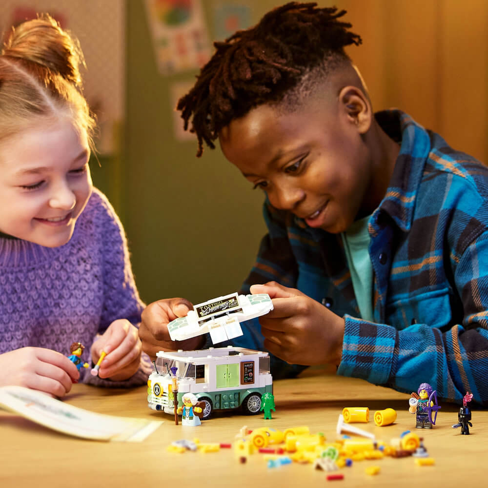 Two children building the LEGO® DREAMZzz™ Mrs. Castillo’s Turtle Van 71456 Building Toy Set (434 Pieces)