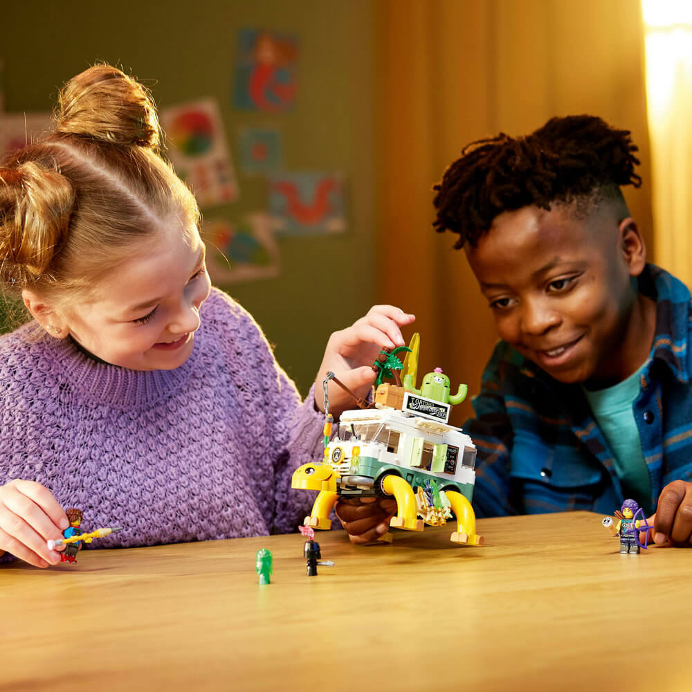 two kids playing with the LEGO® DREAMZzz™ Mrs. Castillo’s Turtle Van 71456 Building Toy Set (434 Pieces)