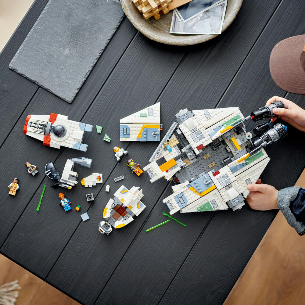 Hands shown building the LEGO® Star Wars Ghost & Phantom II 1394 Piece Building Set (75357)