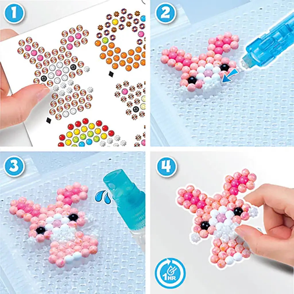 Aquabeads Beginners Craft Studio step-by-step process showing bead template placement, arranging glossy beads on peg board, spraying water, and finished bunny design drying.