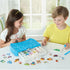Aquabeads Beginners Craft Studio craft activity with two children using blue bead case and peg board to create colorful animal and vehicle bead designs at a white table indoors.
