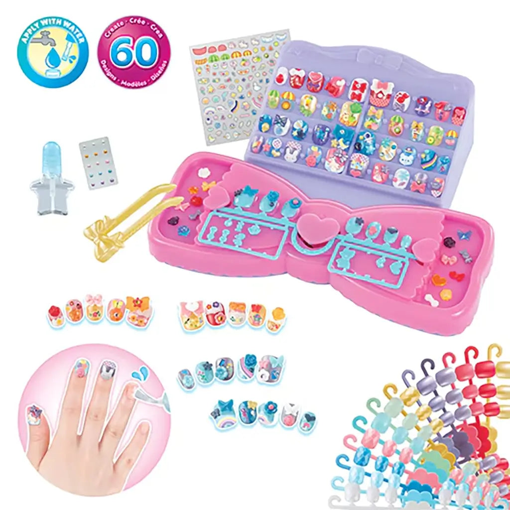 Aquabeads Design & Display Nail Studio playset featuring bow-shaped trays, water applicator, stickers, and 60 colorful nail decorations displayed on a pink and purple base.