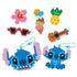 Close-up of completed Disney Aquabeads Stitch keychains and tropical-themed bead crafts including a flower, ice cream, and ukulele, showcasing bright colors and playful handmade designs.