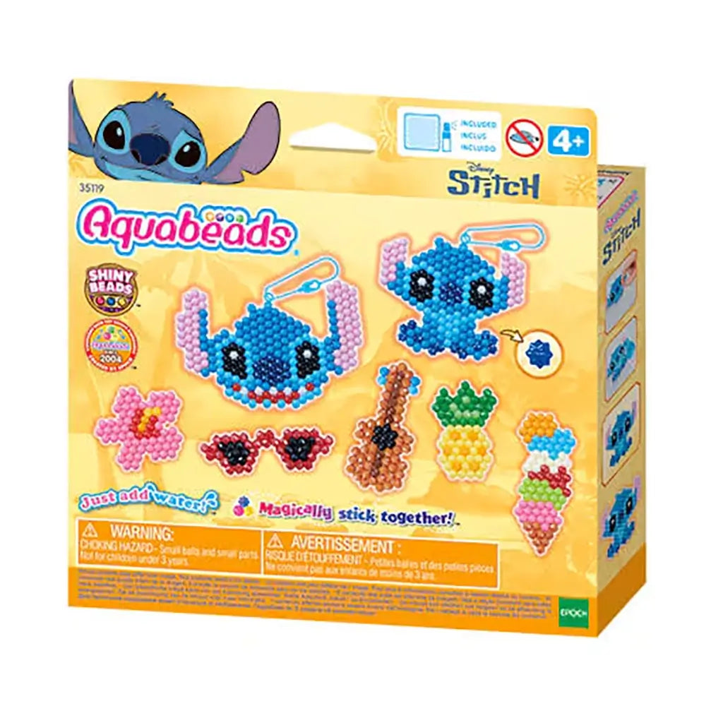 Yellow Disney Aquabeads Stitch craft kit box featuring Stitch bead art examples and text “Just add water!” displayed alongside tropical accessory designs on the front panel.