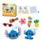 Disney Aquabeads Stitch craft kit featuring colorful bead creations of Stitch, sunglasses, guitar, flower, pineapple, and ice cream, with packaging, spray bottle, and design template included.