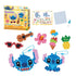 Disney Aquabeads Stitch craft kit featuring colorful bead creations of Stitch, sunglasses, guitar, flower, pineapple, and ice cream, with packaging, spray bottle, and design template included.