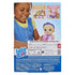 Baby Alive Rainbow Spa Baby package back shows a smiling child placing a cucumber-print mask on the blonde doll, with accessory callouts, illustrated instructions, and multilingual safety and brand text filling the blue lower panel.