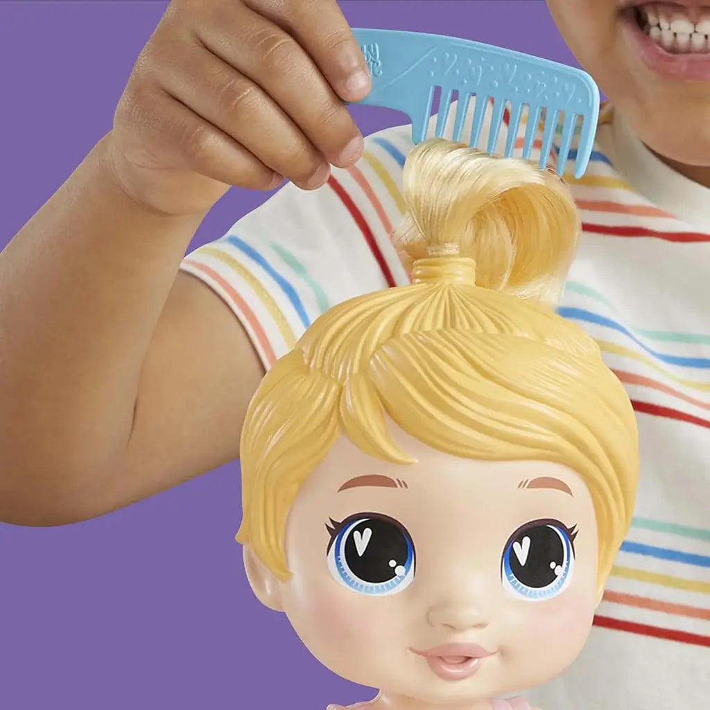 Baby Alive Harper Hugs doll close-up as child combs blond hair, highlighting smooth molded strands and bright expressive eyes against a purple background for imaginative hair-play scenes.
