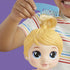 Baby Alive Harper Hugs doll close-up as child combs blond hair, highlighting smooth molded strands and bright expressive eyes against a purple background for imaginative hair-play scenes.
