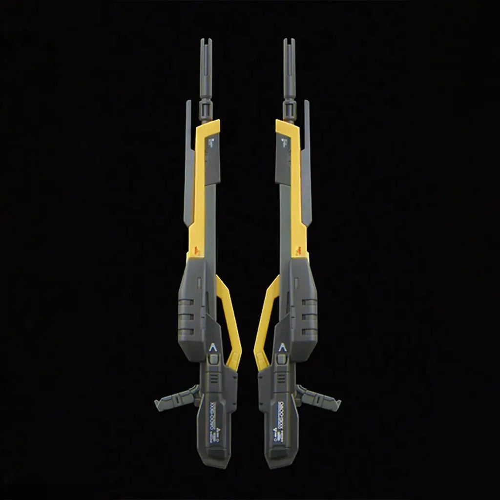 Bandai RG Wing Gundam Zero model kit accessories image presents two identical dark gray and gold twin buster rifles side by side, highlighting molded panel lines and matching handles on a black backdrop.