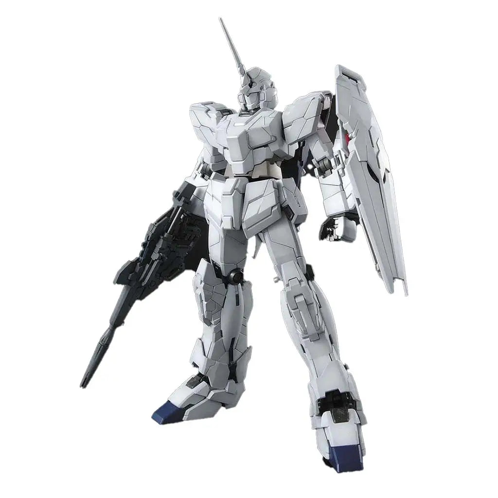 Bandai RX-0 Unicorn Gundam model kit in white plastic armor with angular mech shaping, equipped with rifle and shield, standing in a neutral pose against a clean white backdrop for display collectors.