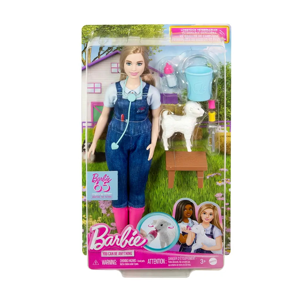 Barbie 65th Anniversary Careers Farm Vet doll in denim overalls and pink boots, packaged with stethoscope, lamb, medical tools, bucket, and barnyard background.