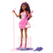 Barbie 65th Anniversary Pop Star Doll displayed on stage stand with microphone, pink guitar, pastel swirl dress, and accessories including bouquet, sunglasses, and jewelry.