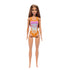 Barbie doll wearing an orange and pink floral swimsuit with cut-out sides. The doll has long brown hair and is standing upright. Ideal for imaginative play and collectors. Toy store product.