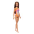 Barbie fashion doll with long brown hair in a floral swimsuit, standing upright with bare feet; ideal for kids' pretend play and doll collection.