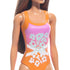 Barbie doll in orange and pink floral swimsuit with white crisscross bands, shown from shoulders down. Long brown hair. Great for beach-themed pretend play and doll collectors.