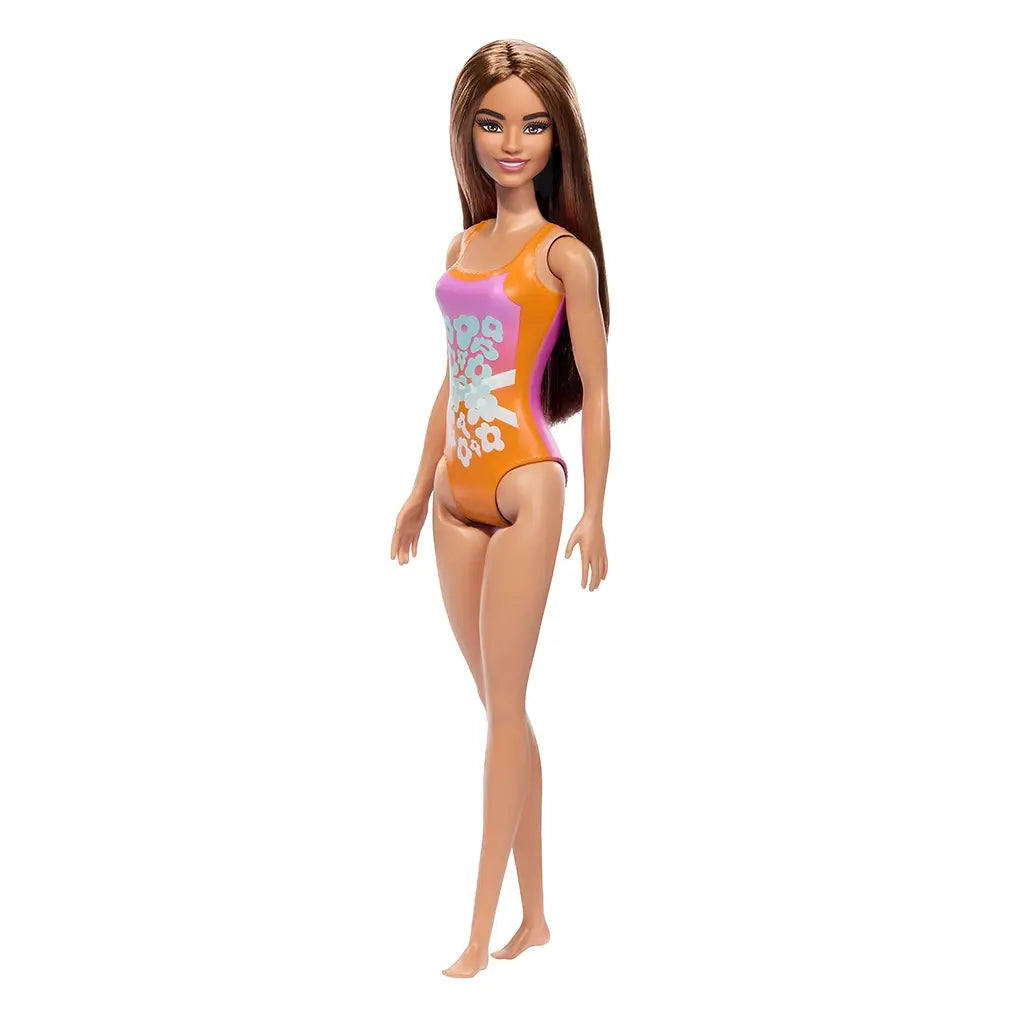 Fashion doll in orange and pink floral swimsuit with long brown hair, posed upright. Great for imaginative play, doll collections, and gifting to kids who love Barbie-style toys.