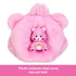 Plush pink Care Bear costume head turned into a pet bed holding a small rainbow-bellied Care Bear mini figure, part of Barbie Cutie Reveal Care Bears set.